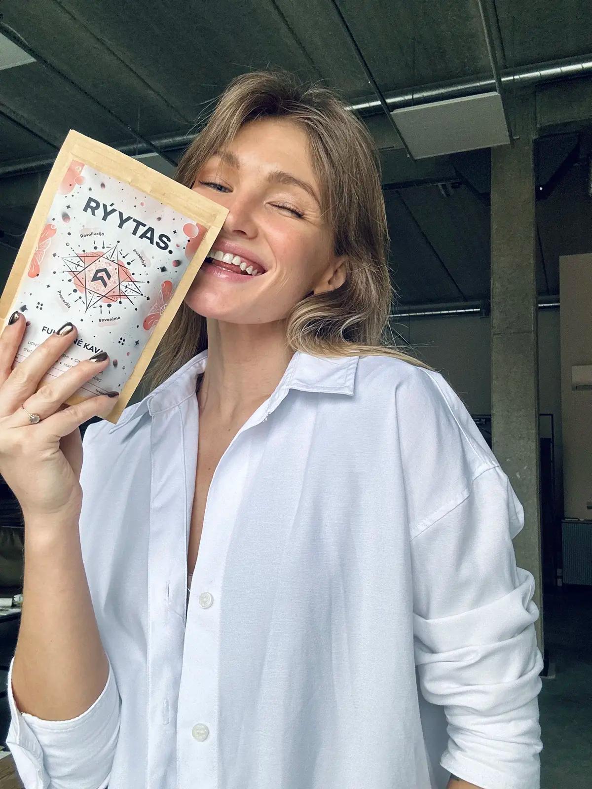 Woman enjoying RÝYTAS functional coffee